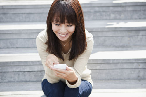 Young woman using a smart phone.