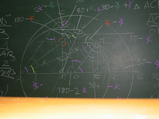 Geometry problem worked out on a chalkboard.