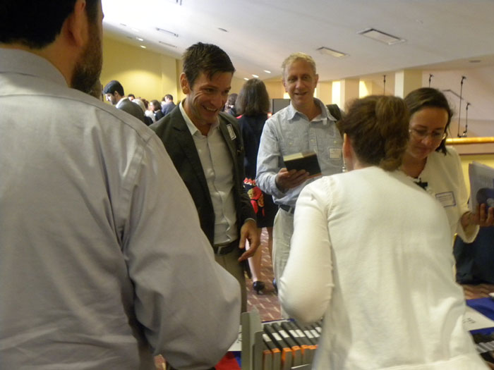 Georgia State University librarians give copies of Peter Suber's book Open Access to new faculy.