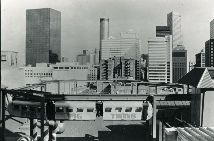 One of the Pink Pig Twins flying above Rich's downtown Atlanta rooftop in 1987. For decades, the monorail delighted children during the holidays. Copyright: Atlanta Journal-Constitution.