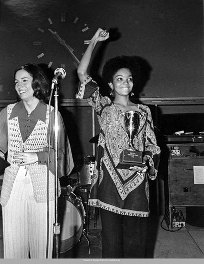 Mrs. and Miss Homecoming queens Gloria Shurbutt Beachham (left) and Marcia Briscoe celebrate their victories in 1970