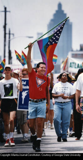 Jay Shoemaker leading group of marchers in the annual Gay Pride celebrations and parade, Atlanta, Georgia, June 27, 1993.