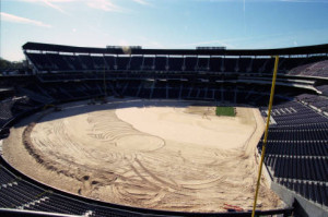 Installation of the playing field after reconfiguration of Olympic Stadium into Turner Field, March 1997 [AJCNL1997-03-12-01c]