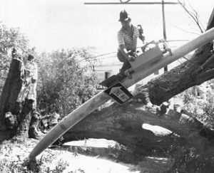 Workers fix a broken traffic light in Savannah, GA after Hurricane David in 1979.