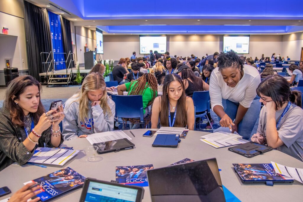 Group of Georgia State University students sitting around a table working together on a project